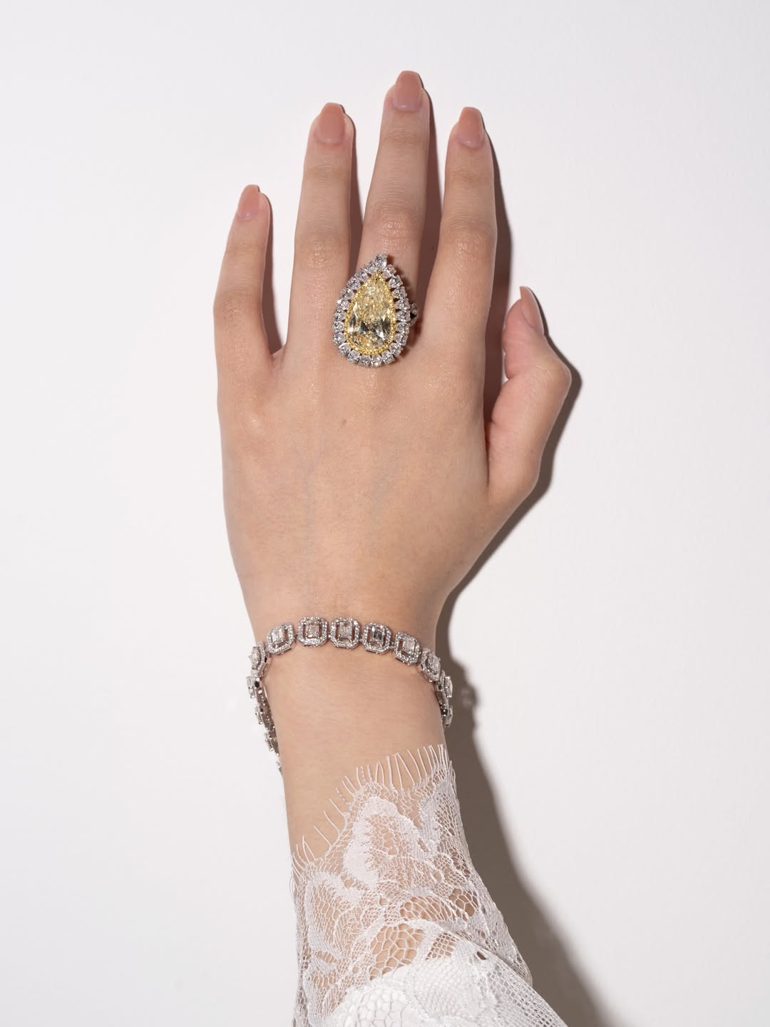 Yellow pear ring and diamond bracelet